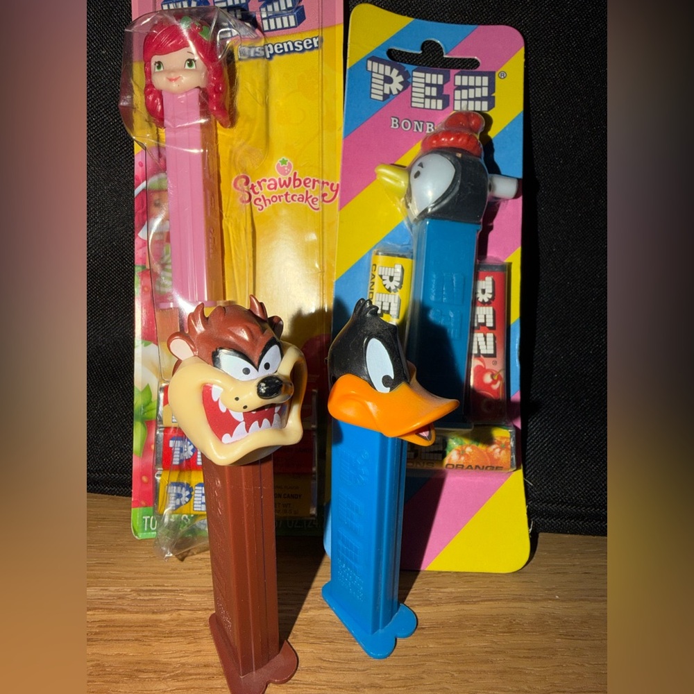 Pezdispensers: strawberry shortcake,Daffy duck Tasmanian devil &merry musicmaker